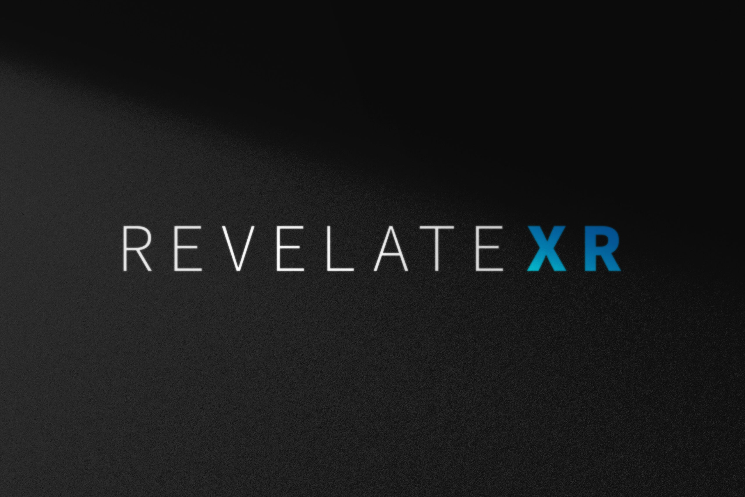 RevXR_Identity_Mockup_05 RevelateXR logo – modular brandmark representing immersive XR connectivity